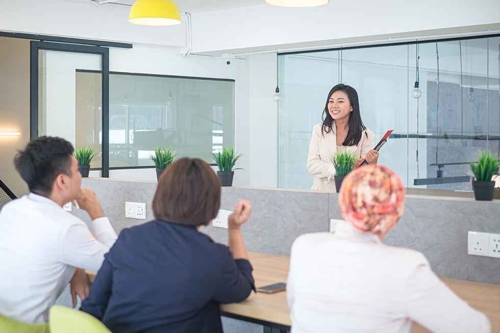 Woman trains employees a new technology