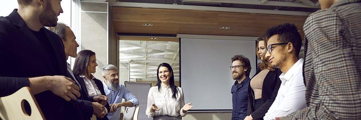 Woman trains her colleagues at work