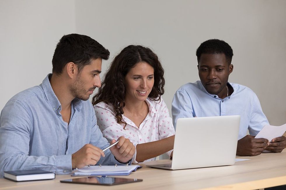 Woman trains new employees at work