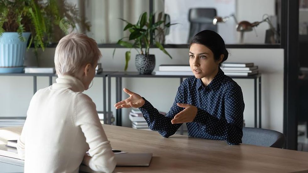 Woman tries to be interesting during a job interview