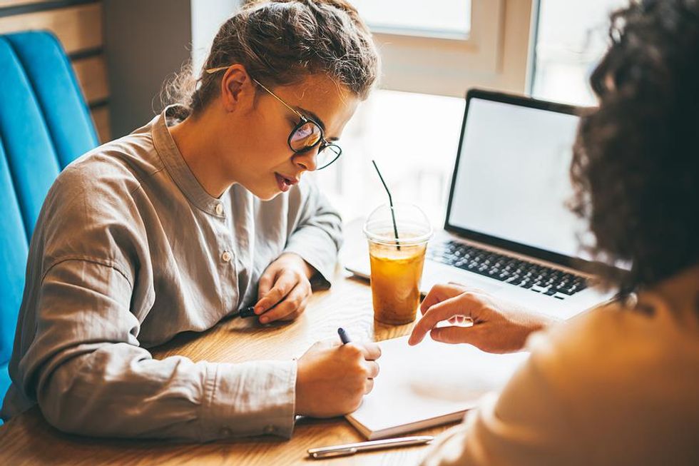 Woman tries to improve her persuasive writing skills