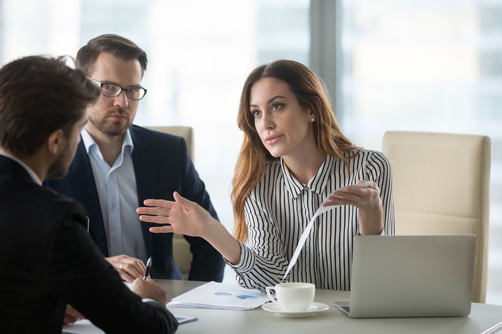 Woman tries to resolve a conflict at work