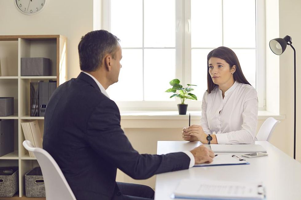 Woman tries to stand out from the competition in a job interview