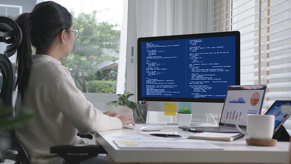 Woman use AI (artificial intelligence) on the job while working from home