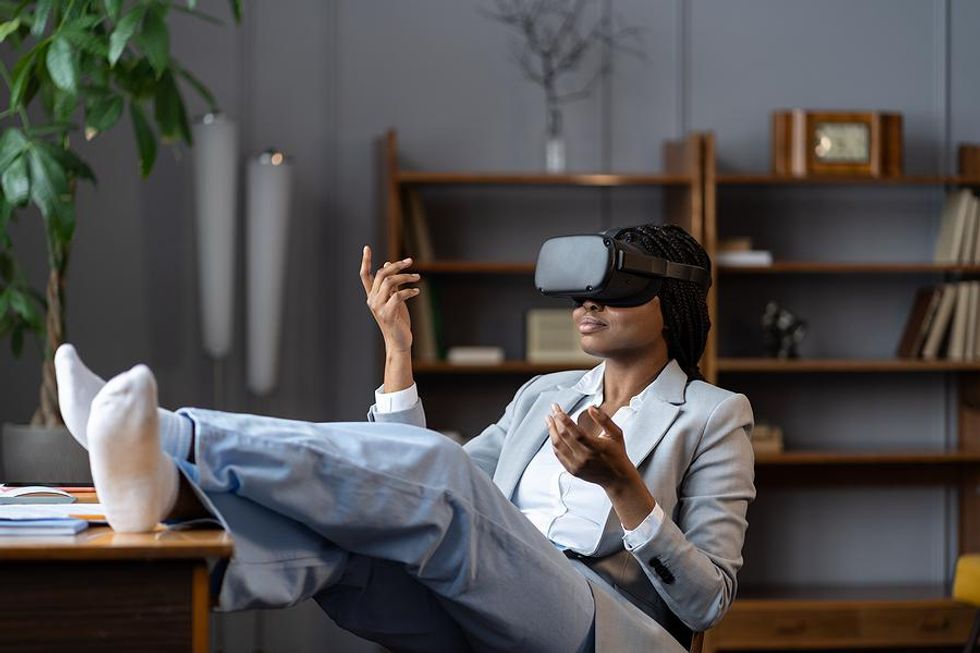 Woman uses virtual reality technology at work