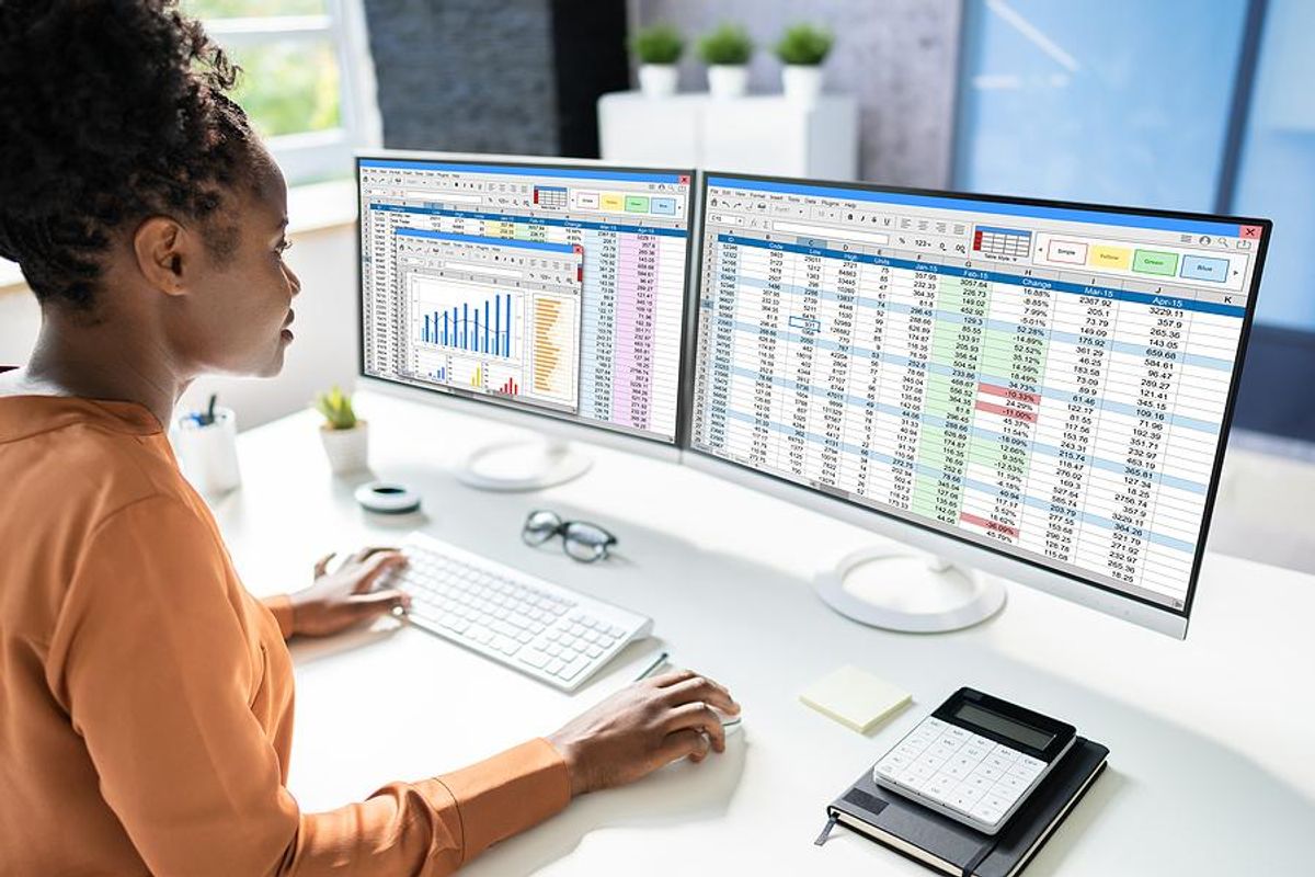 Woman using Excel to make a spreadsheet on her computer