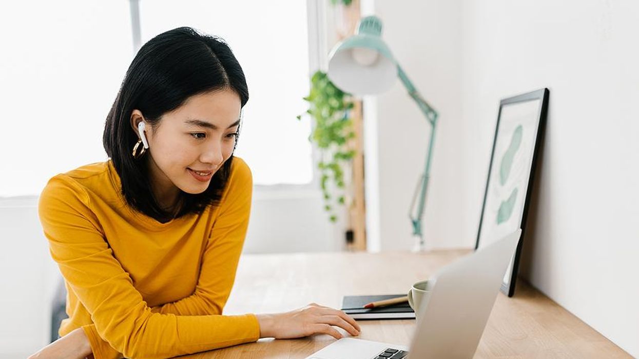 Woman watches a job search workshop on her laptop