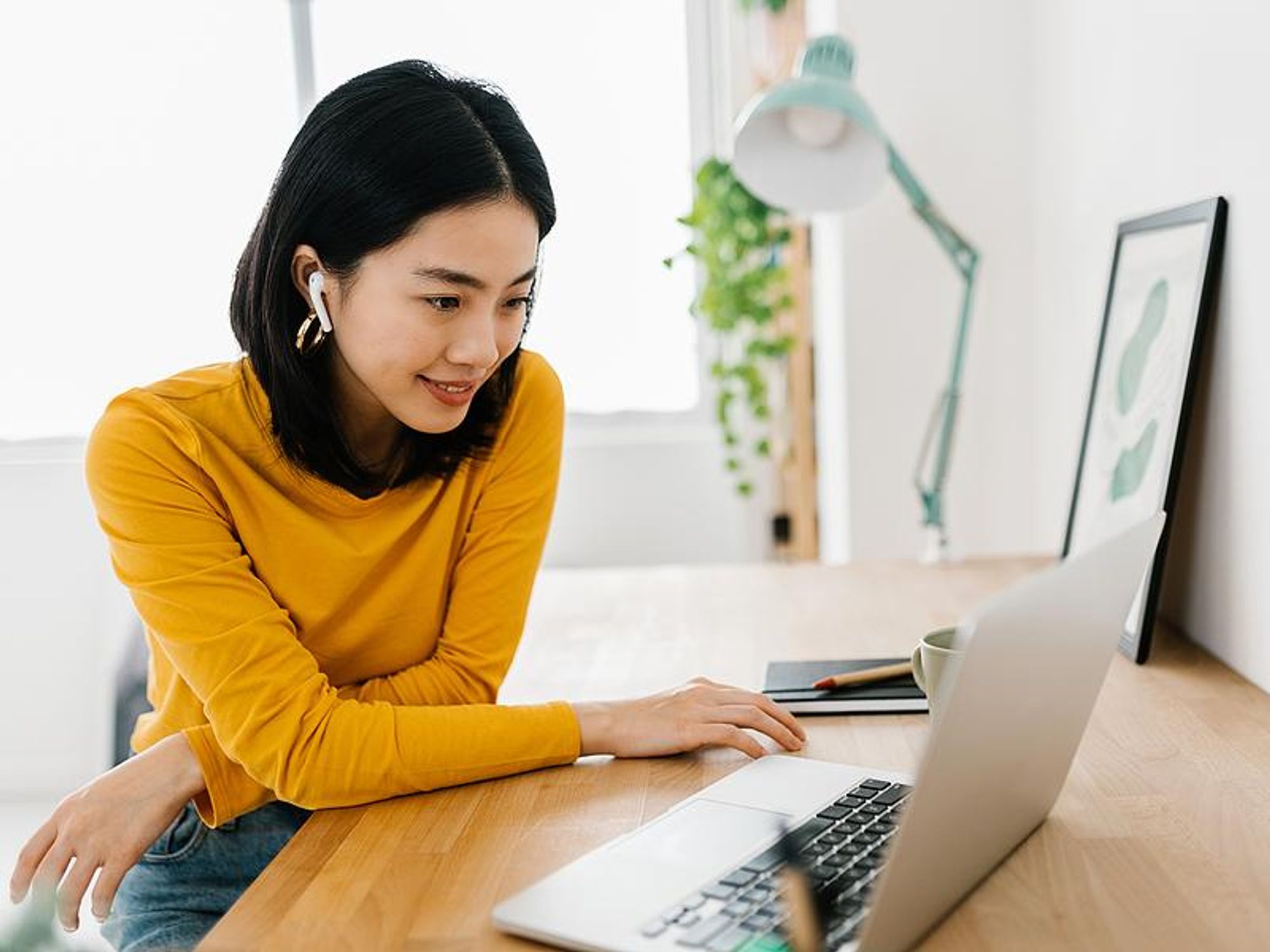 Woman watches a job search workshop on her laptop