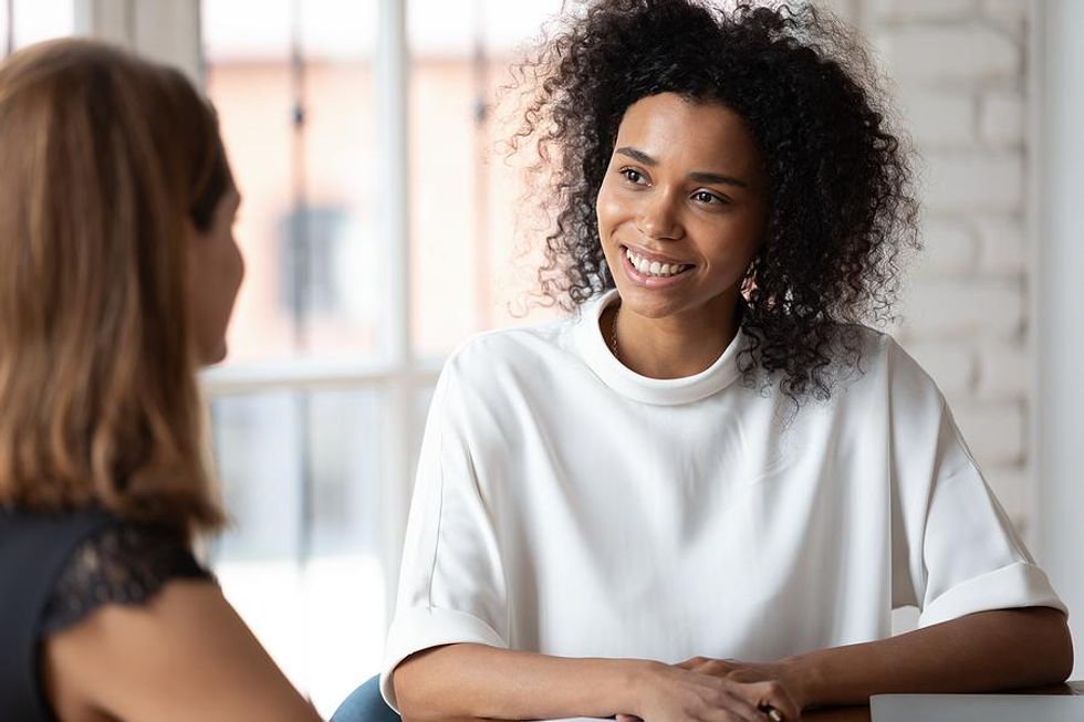 Woman with good body language smiles during a job interview