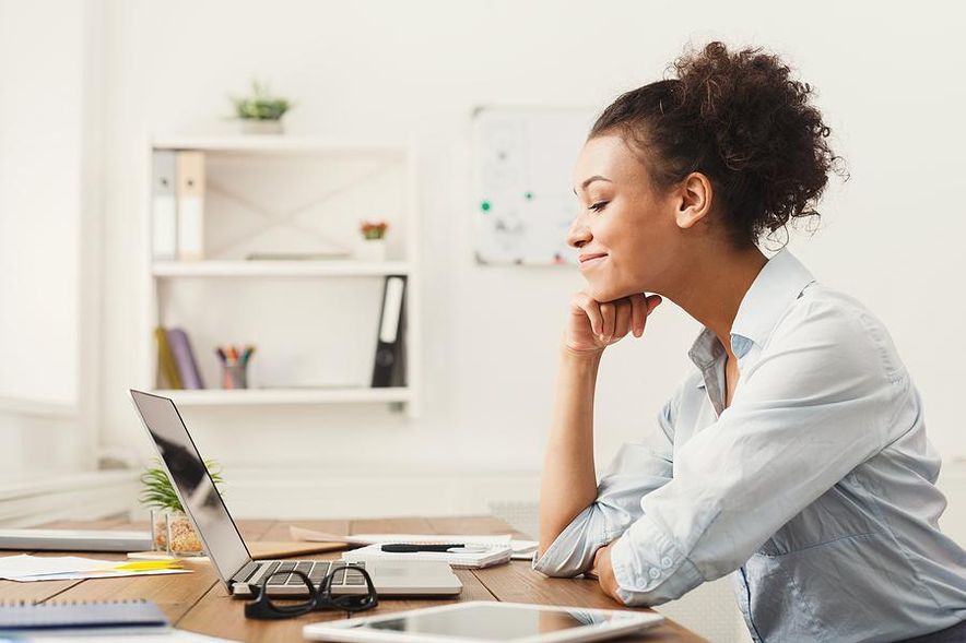Woman working for a company that pays for her vacation