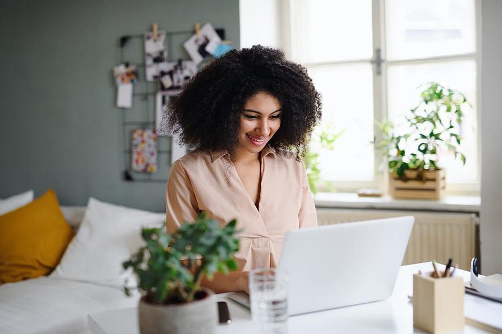 Woman works from home during the summer