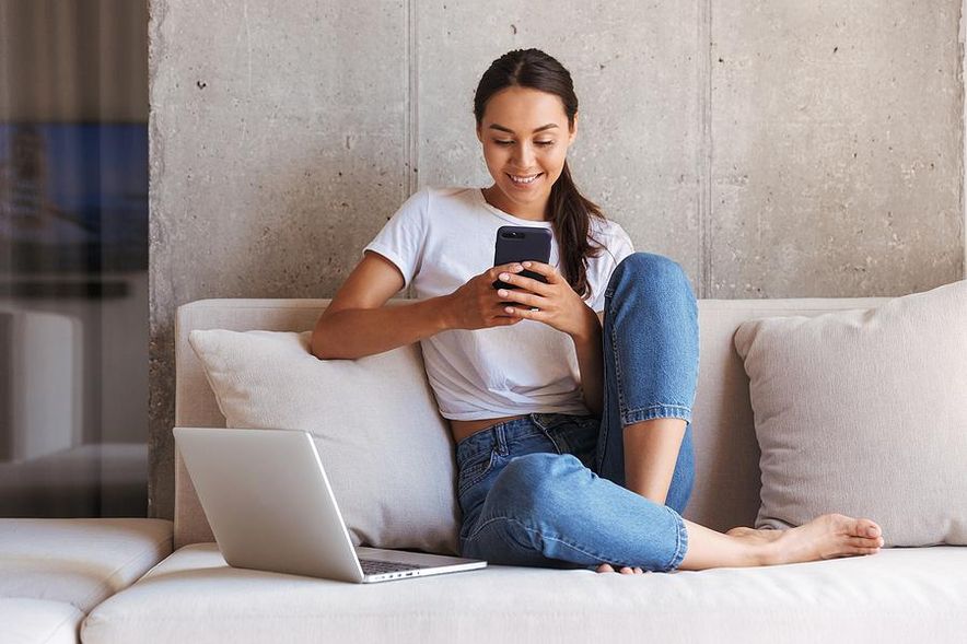 Woman works from home for a company that pays for her vacation