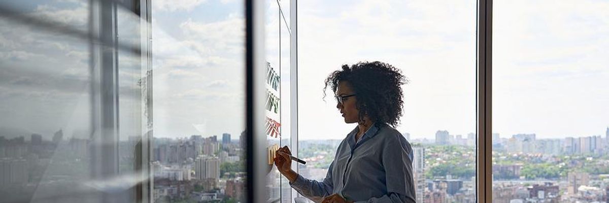 Woman works on her career at work