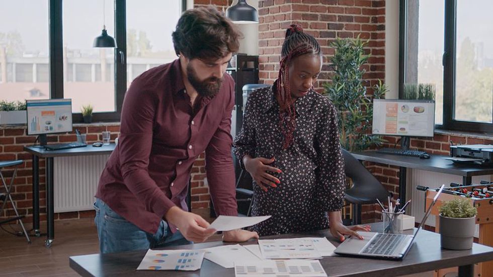 Woman works while pregnant