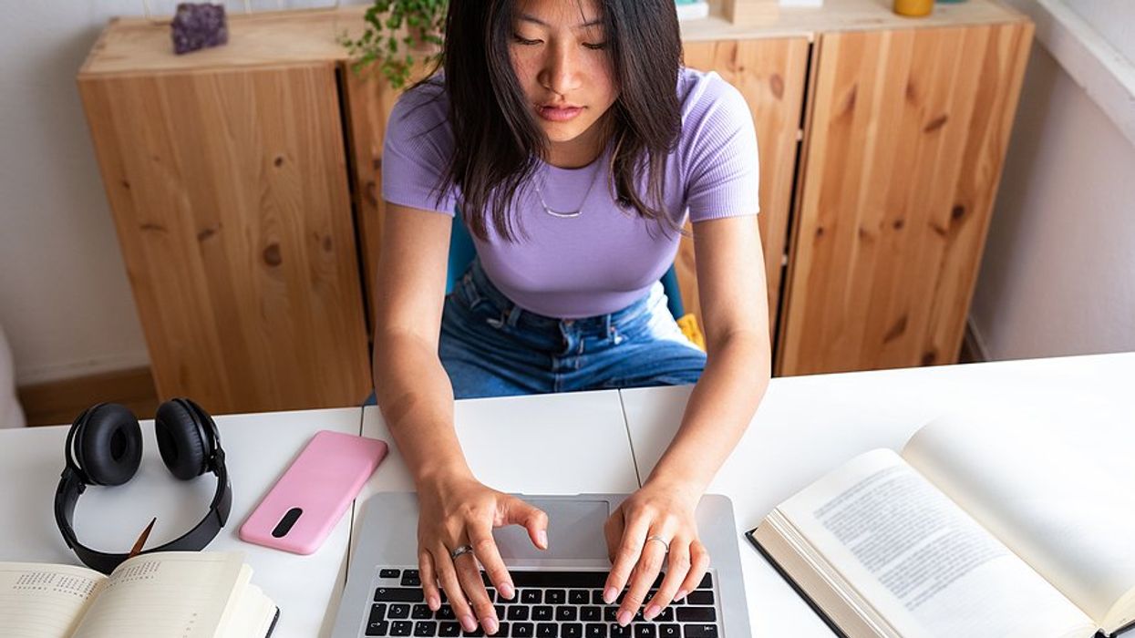 Woman writes a follow-up email to a recuiter