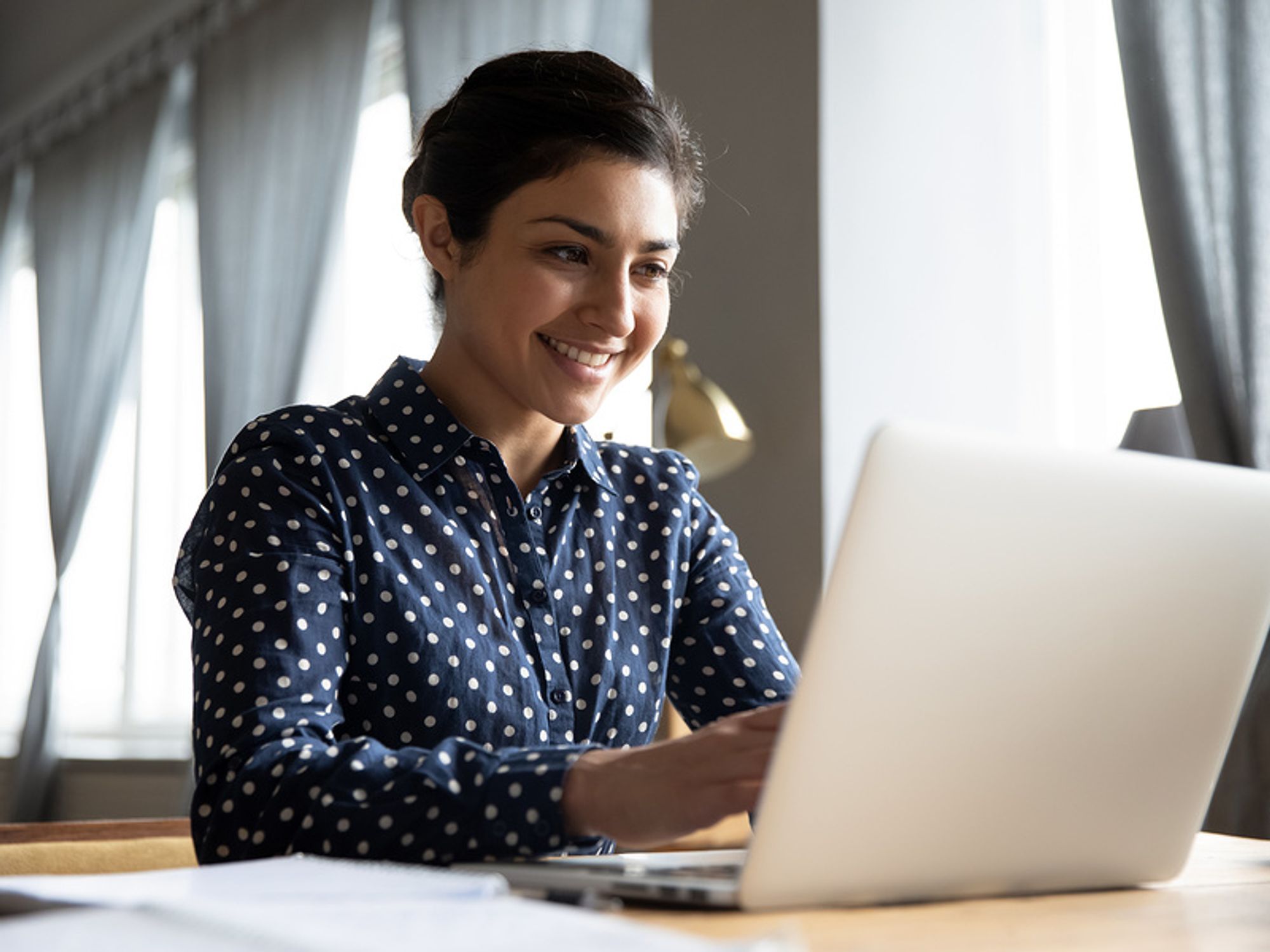 Woman writing her cover letter for a job posting