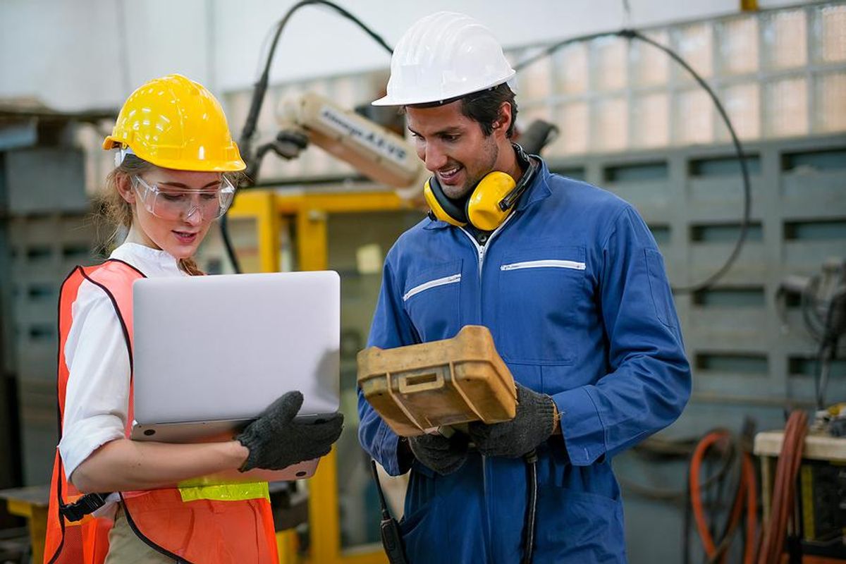 Workers go over safe workplace practices