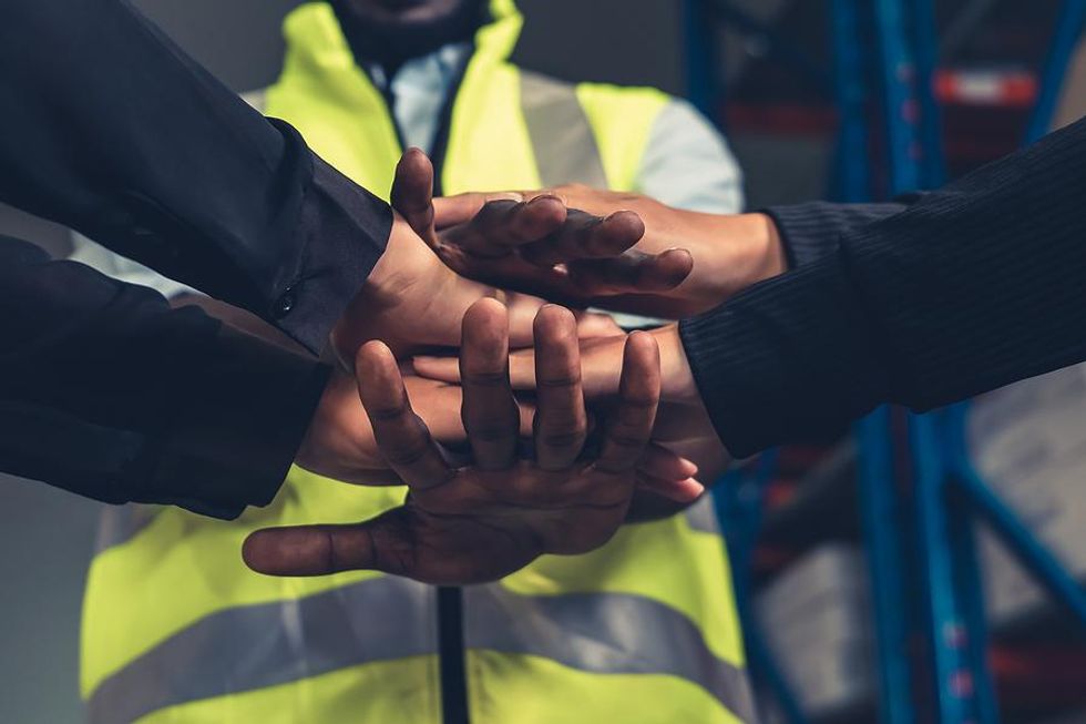 Workers huddle up at work