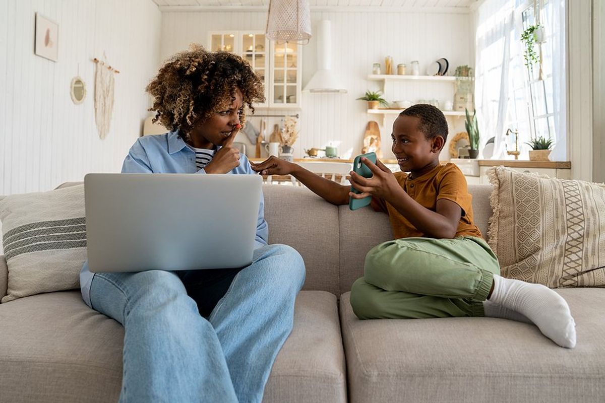 Working mom/parent balances work and family life while working from home