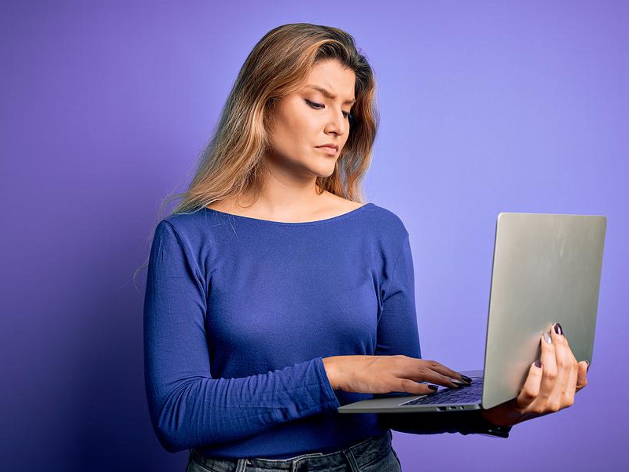 Working woman looking at laptop