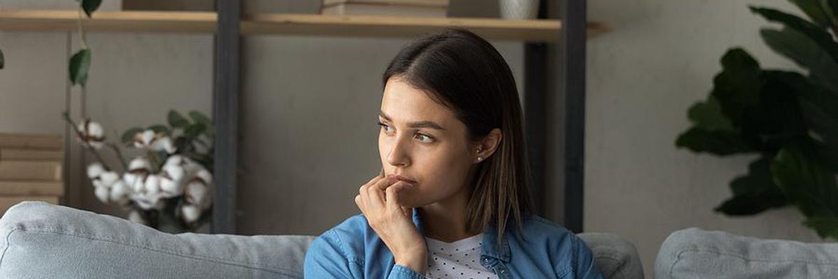 Worried woman thinks about quitting her job