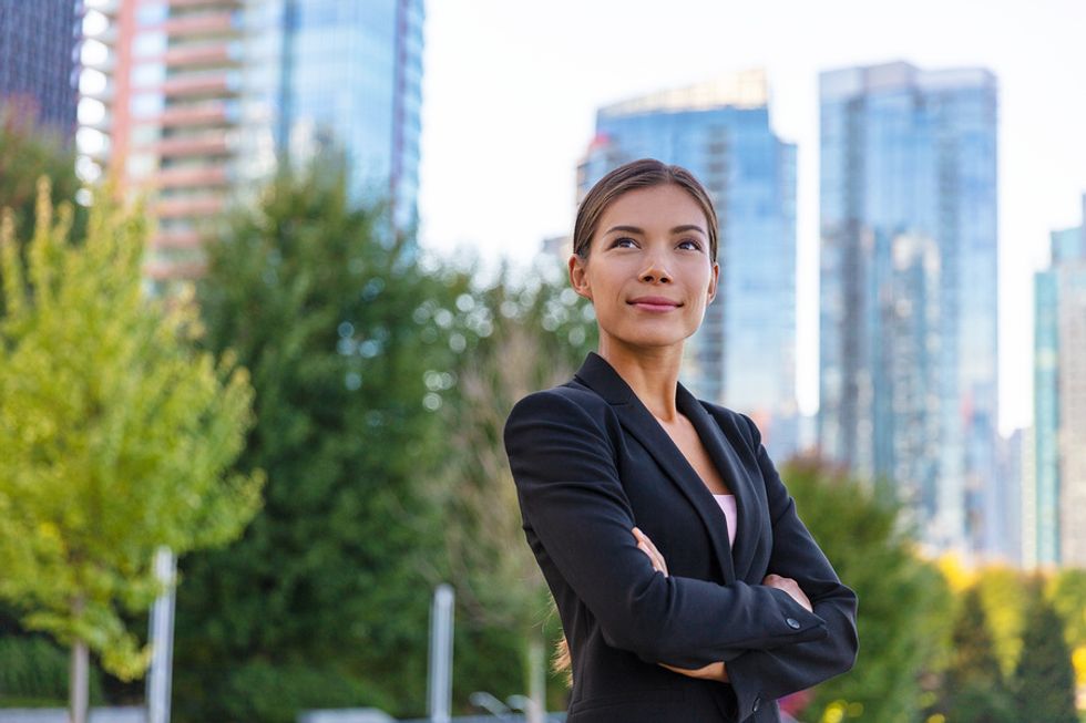 Young businesswoman thinks about preparing her career for the upcoming recession