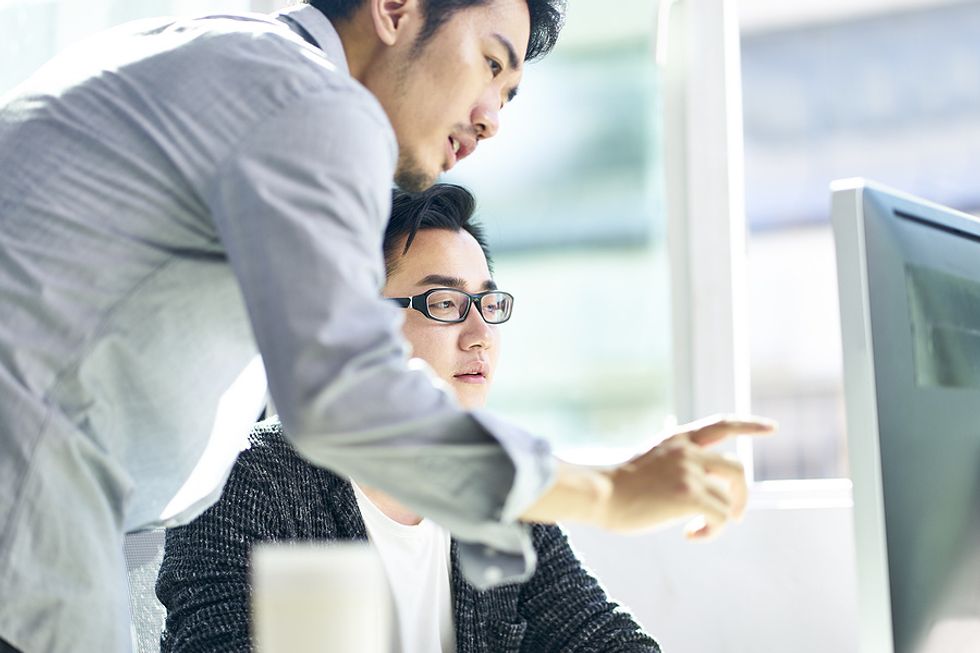 Young executive helps out a colleague