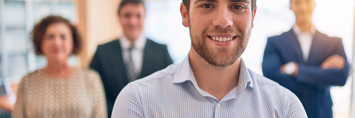 Young executive in a meeting with other executives
