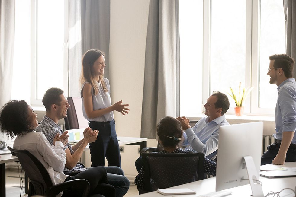 Young executive talks about one of her ideas during a meeting