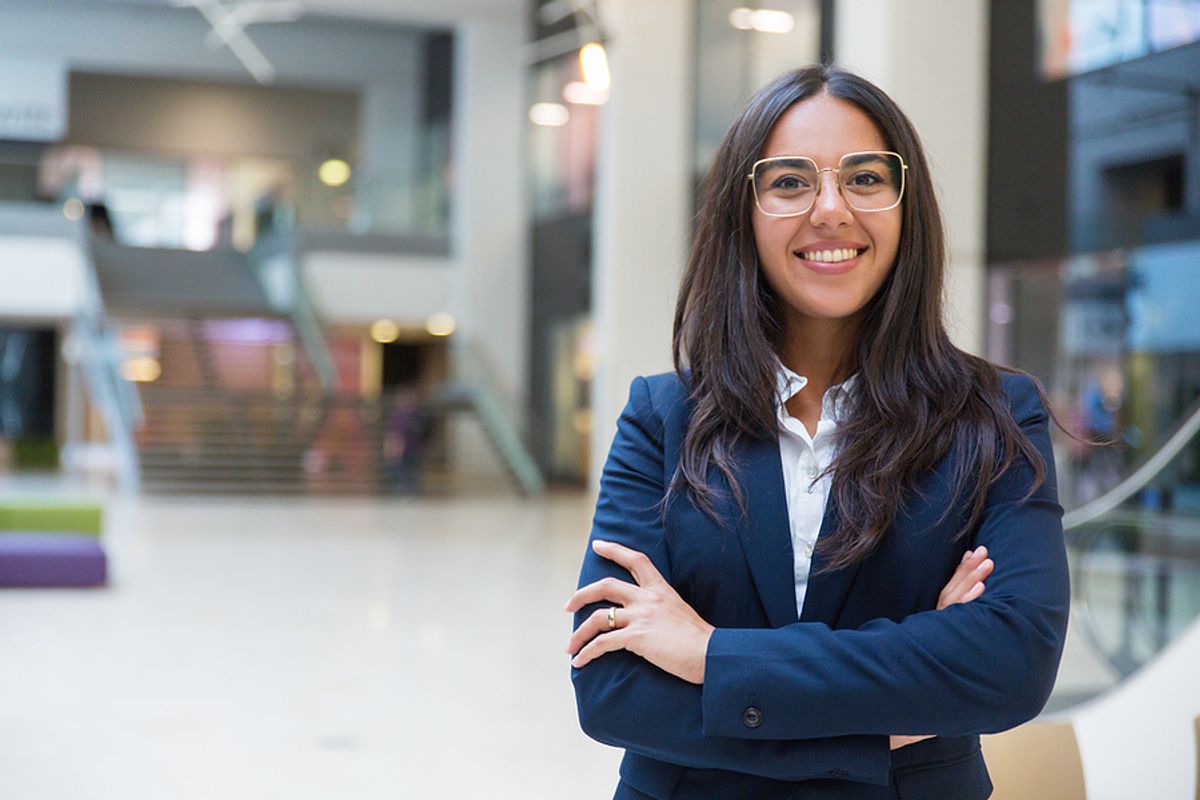 Young leader smiles at the camera