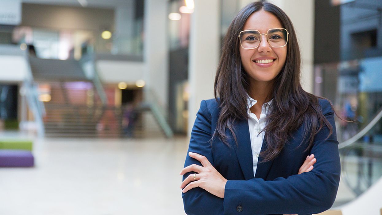 Young leader smiles at the camera