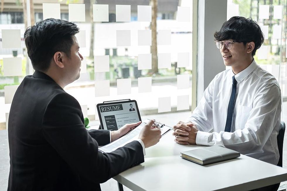 Young man smiles during a job interview