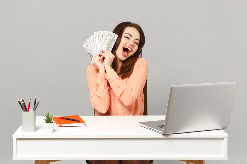 Young professional enjoys saving money during a career transition.