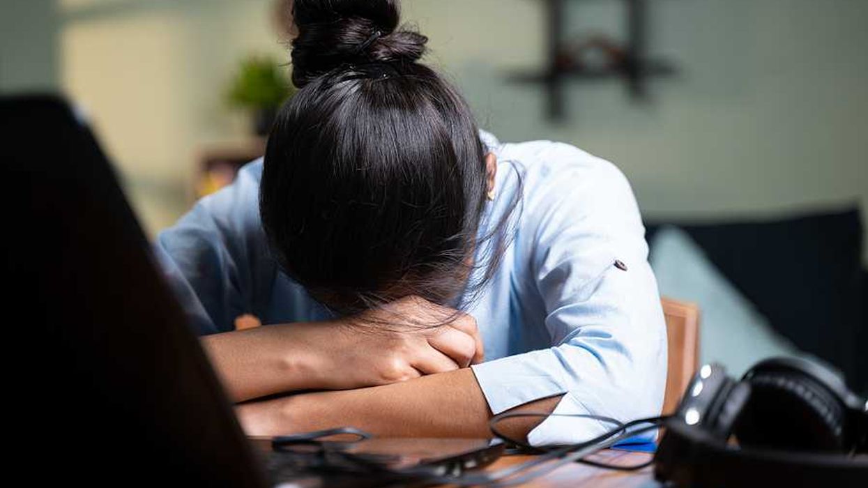 Young professional experiences burnout at work