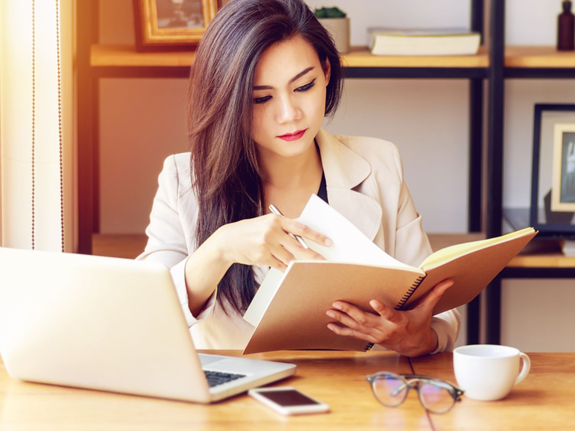 Young professional makes her final preparations for a job interview.