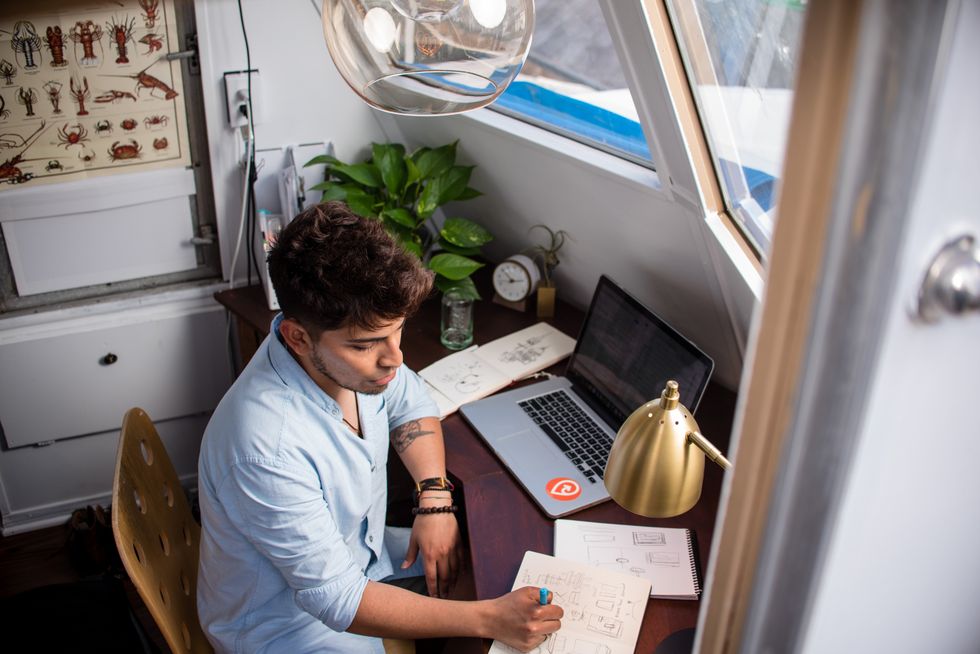 Young professional manages multiple different tasks.