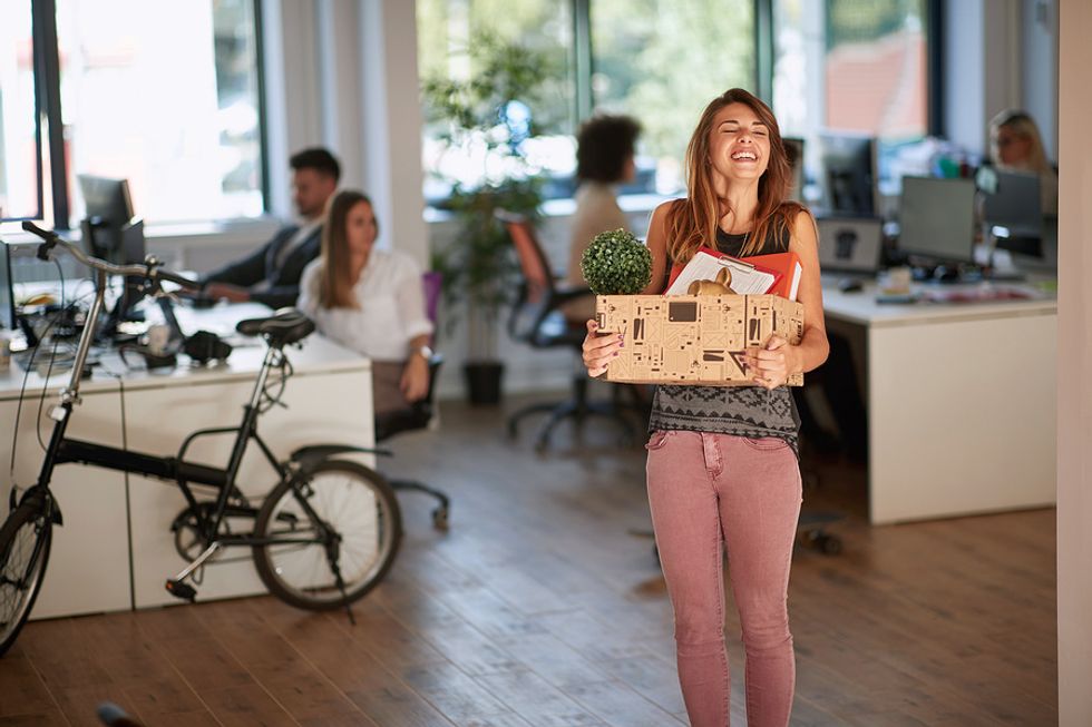 Young professional moves into her new office after getting a new job