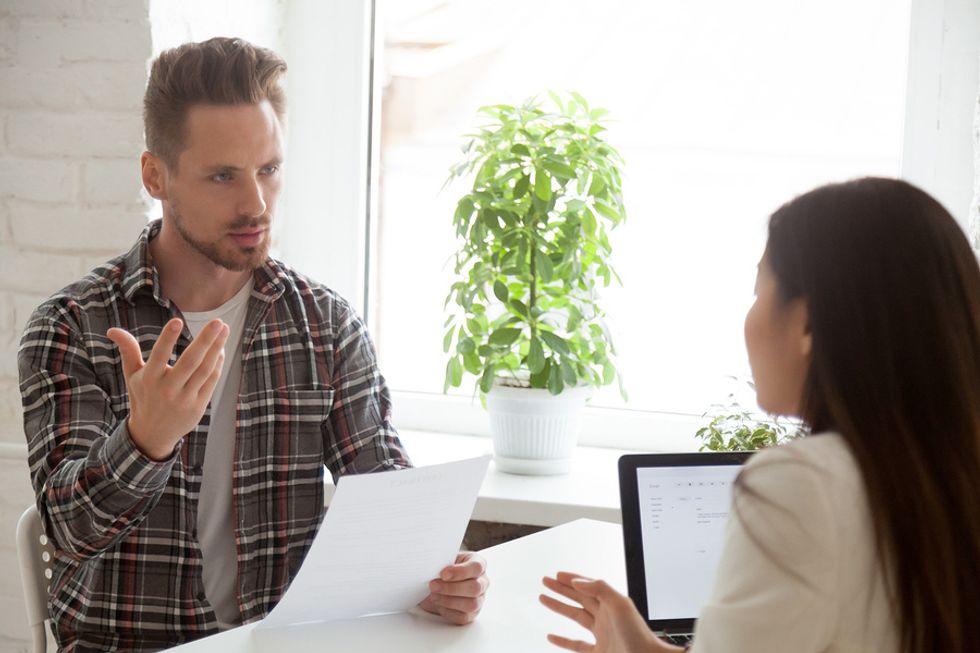 Young professional negotiates salary during job interview