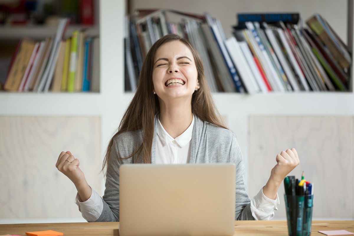 Young professional shows excitement over an accomplishment.