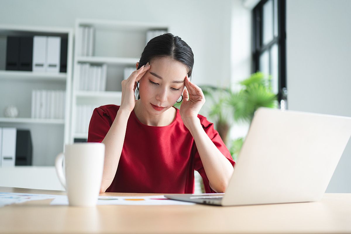 Young professional shows signs of stress at work on a Monday morning