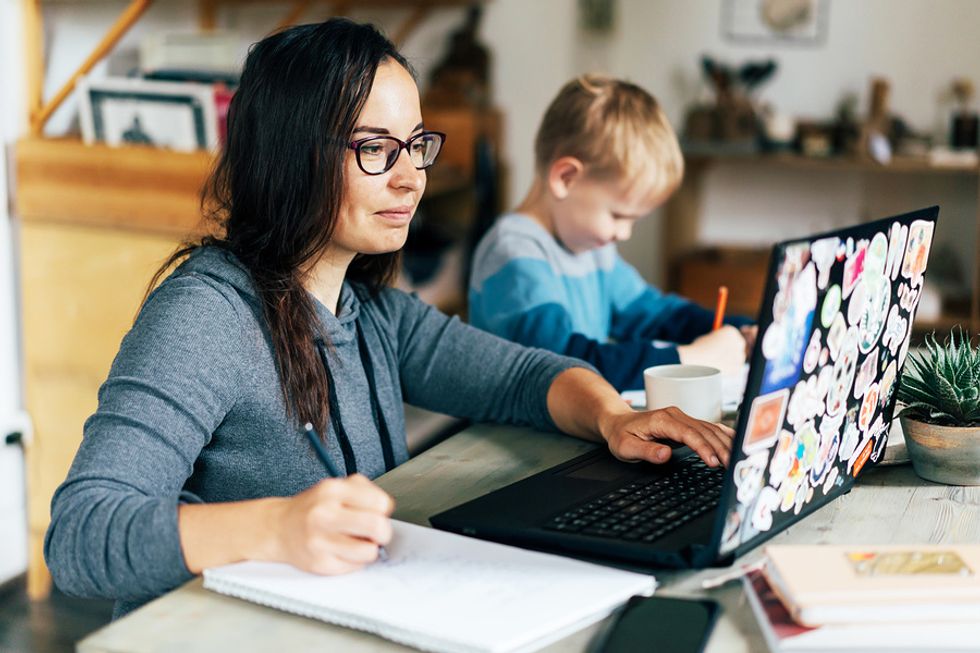 Young professional takes an online course on her laptop in hopes of changing careers