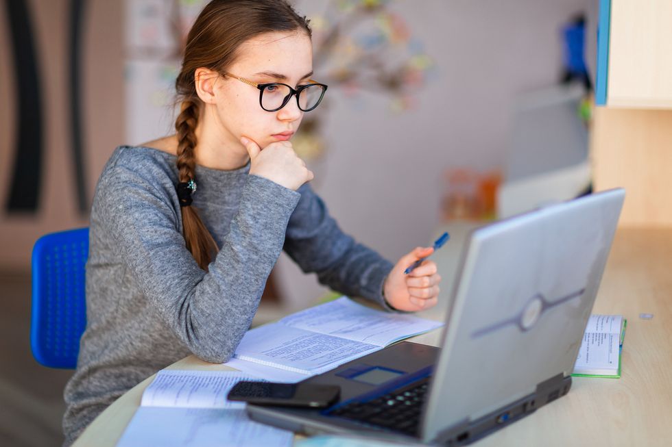 Young professional takes an online course.