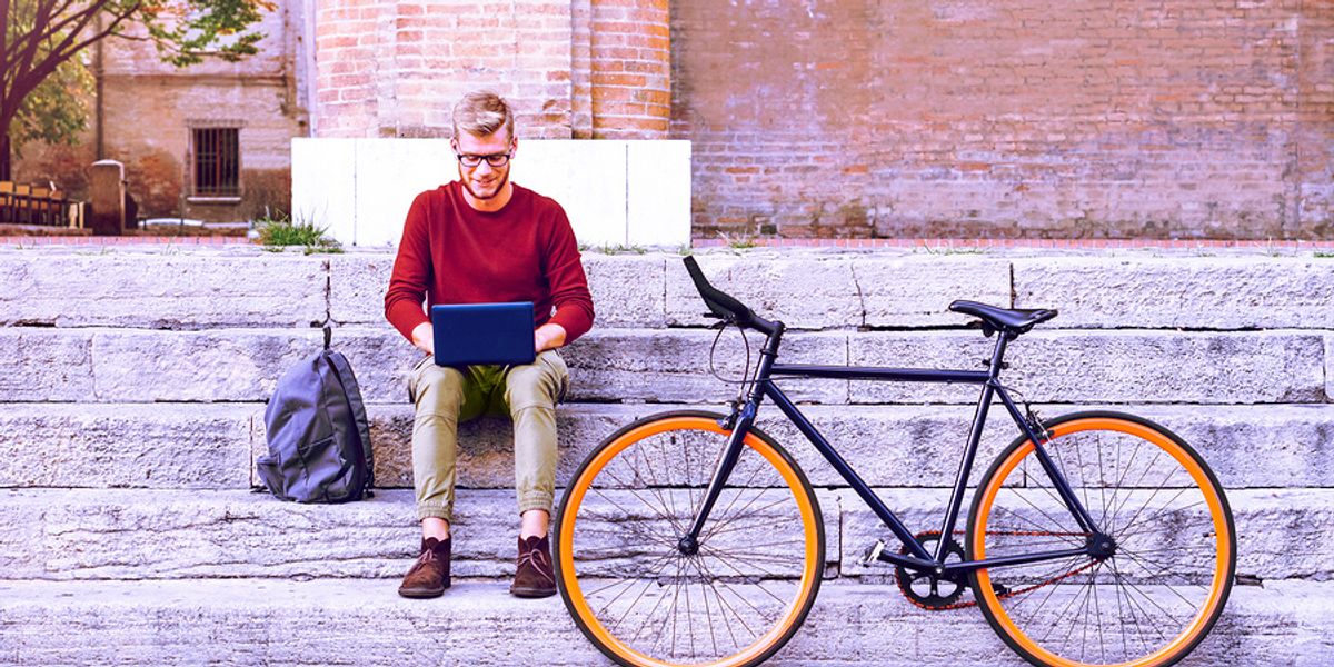 Young professional works outside.