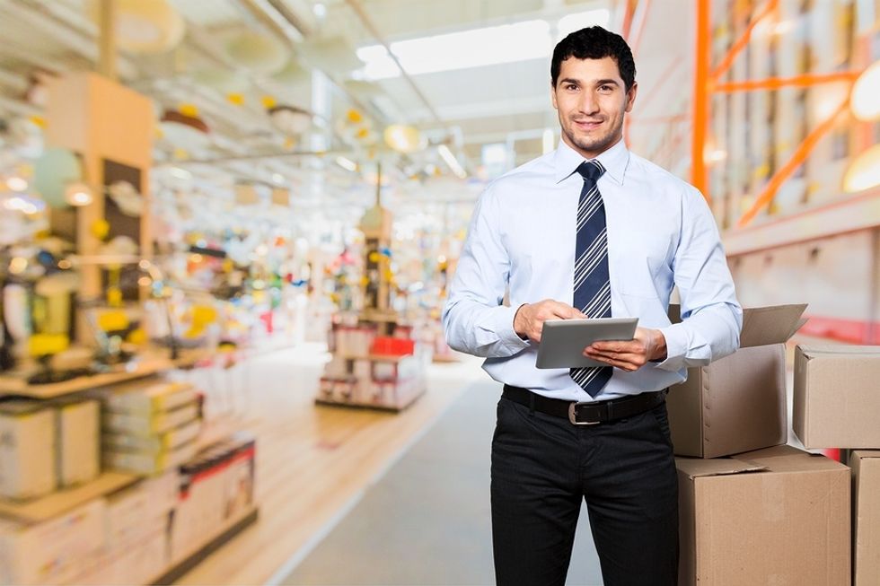 Young professional works part-time job while looking for full-time employment.