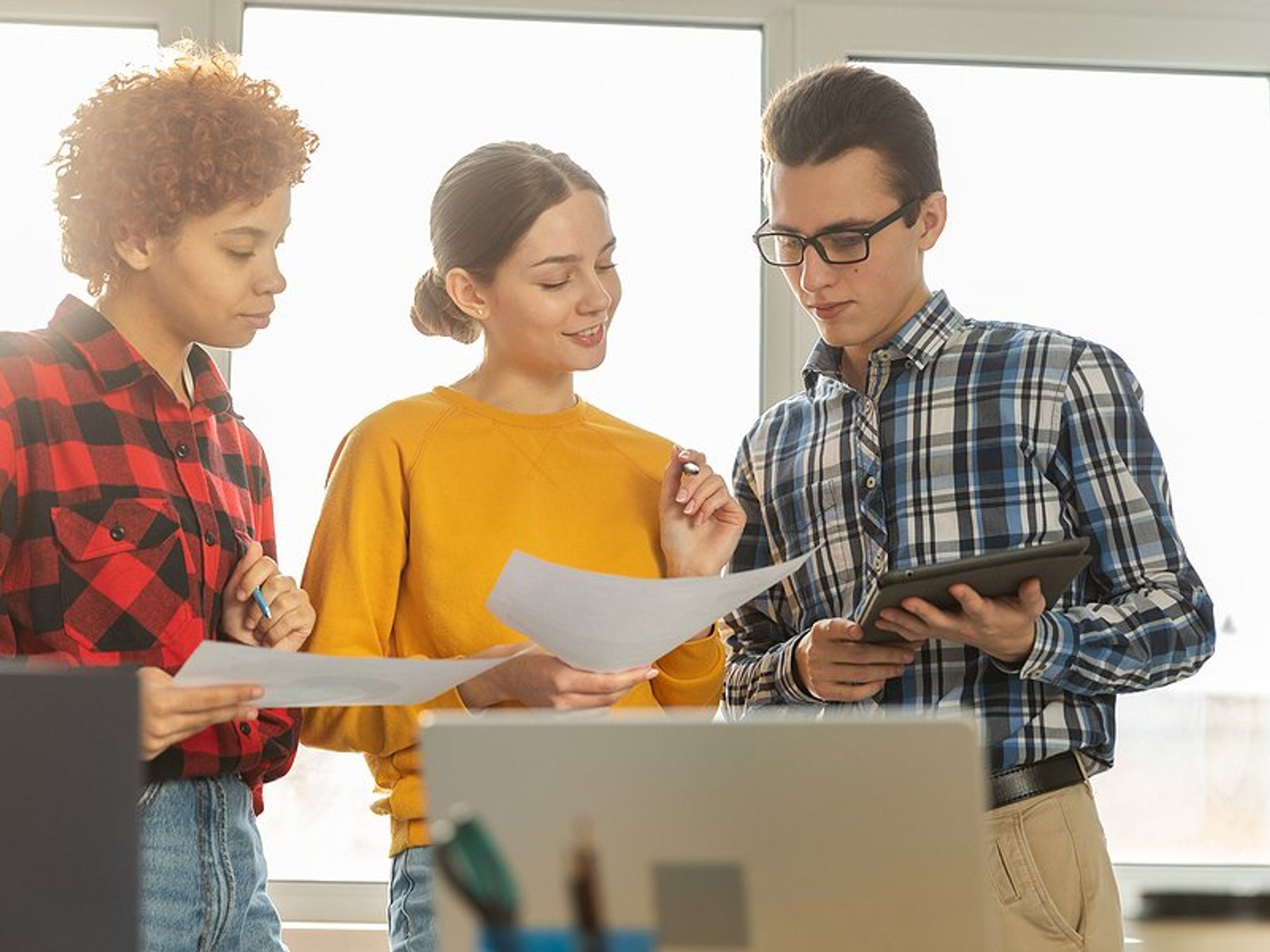 Young professionals collaborate and gain confidence at work