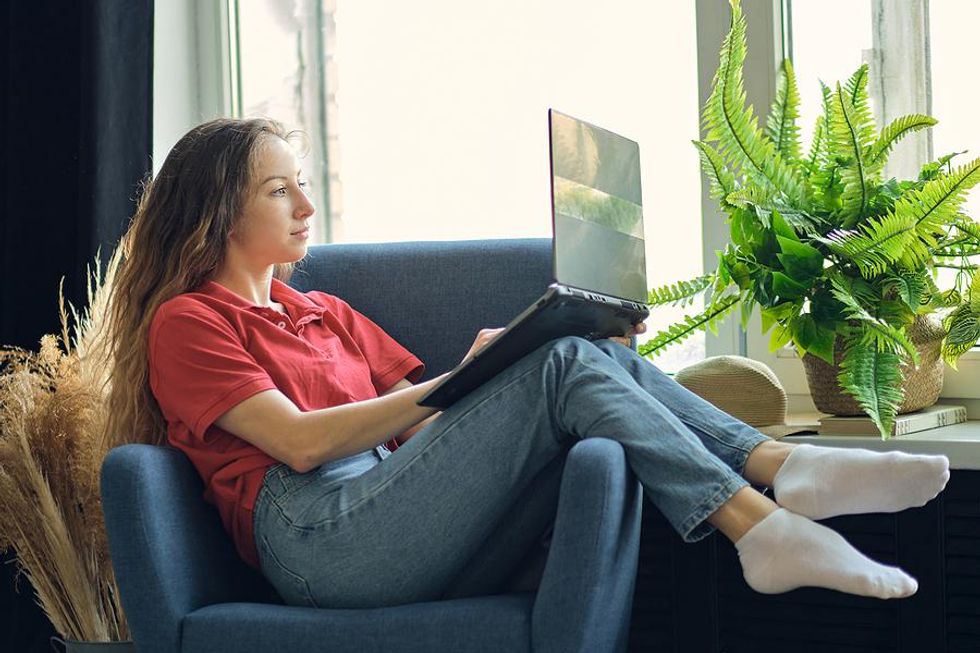 Young woman looks for a job while unemployed