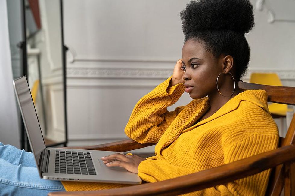 Young woman removes information from her resume