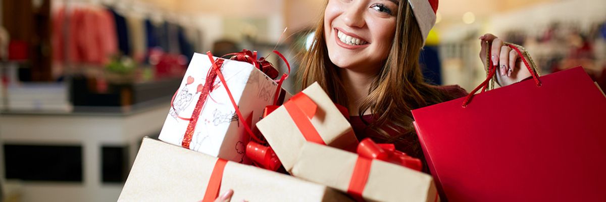 Young woman works a seasonal retail job during the holiday season.