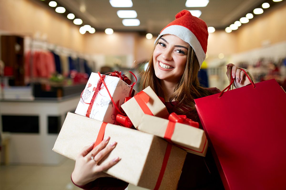 Young woman works a seasonal retail job during the holiday season.