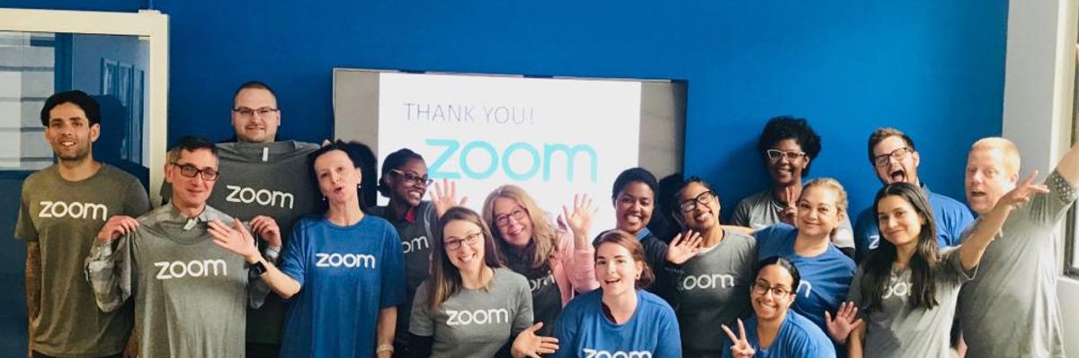 Zoom employees pose for a photo at the company's San Jose headquarters.